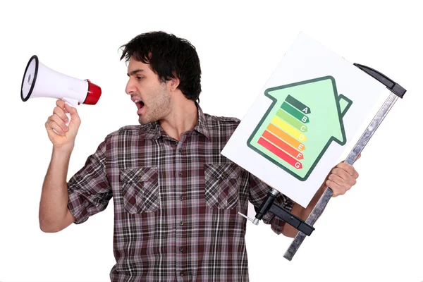 Young man screaming in bullhorn — Stock Photo, Image