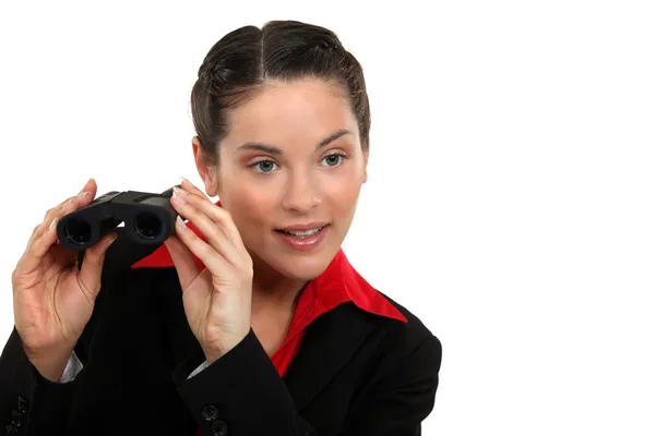 Businesswoman with pair of binoculars — Stock Photo, Image