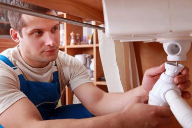 Plumber fixing sink clipart