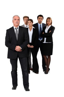 Studio shot of businessman and his team clipart