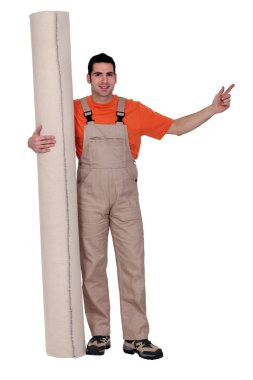 Man with a roll of carpet clipart