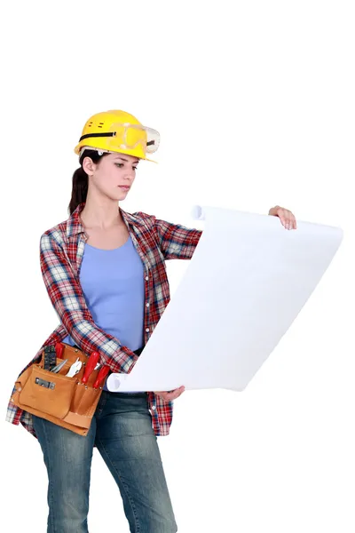 Female project manager examining plans — Stock Photo, Image