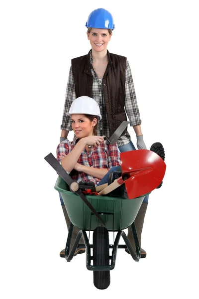 Woman being pushed in wheelbarrow — Stock Photo, Image