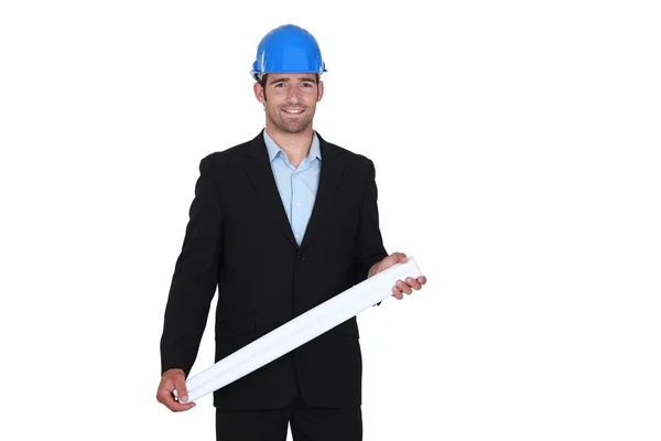 Architect stood with rolled-up plans — Stock Photo, Image
