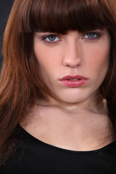 Close-up portrait of attractive brunette looking worried — Stock Photo, Image