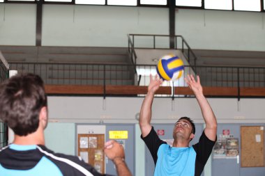 Handball team playing on indoor court clipart