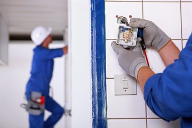 Worker installing a plug clipart