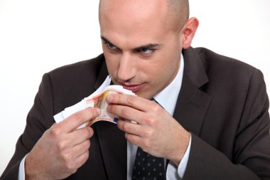 Bad man smelling money clipart
