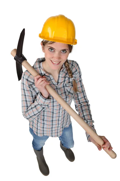 Smiling woman with a pickaxe — Stock Photo, Image