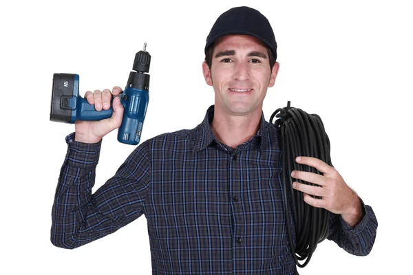 Eletricista com uma broca — Fotografia de Stock