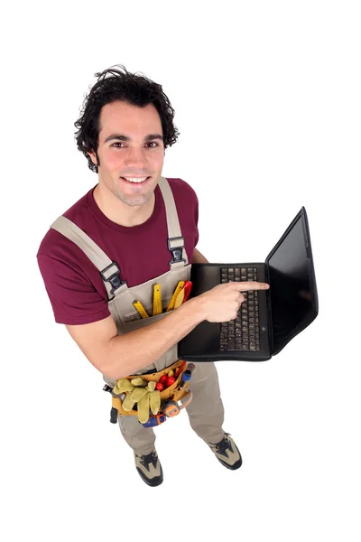 Tradesman with his laptop — Stock Photo, Image