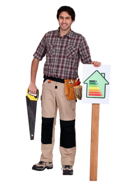 Carpenter stood by energy efficiency label — Stock Photo, Image