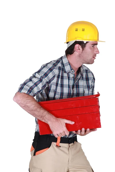 Man running off with tool box — Stock Photo, Image