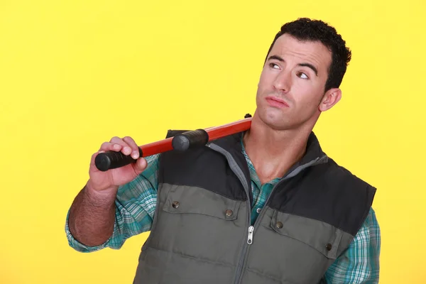 Man resting bolt cutters over shoulder — Stock Photo, Image