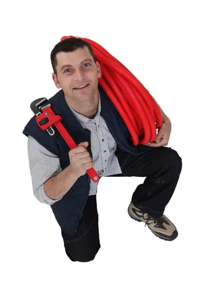 A kneeled plumber. — Stock Photo, Image