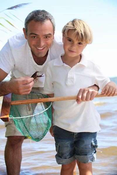 Батько і син рибалка — стокове фото
