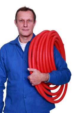 Fully-fledged plumber carrying red hose clipart