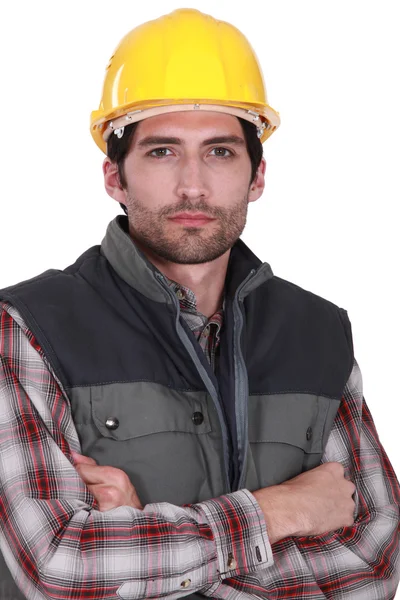 Builder stod med armarna korsade — Stockfoto