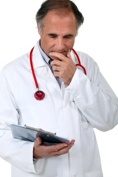 Doctor with a stethoscope and clipboard — Stock Photo, Image