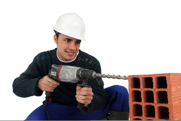 Worker with a masonry drill — Stock Photo, Image