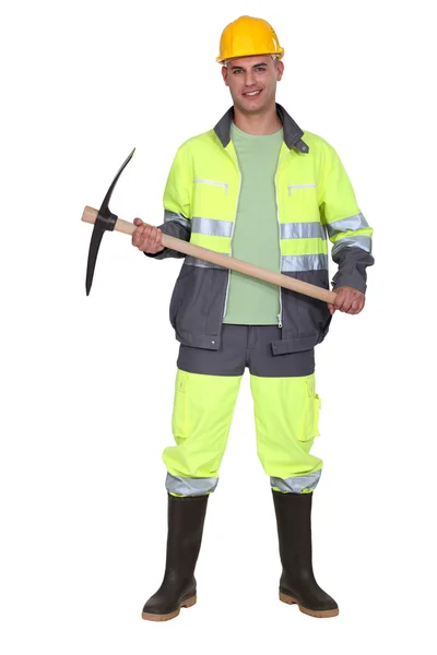 Worker holding pick-axe — Stock Photo, Image