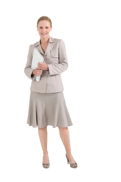 Smiling teacher holding laptop — Stock Photo, Image