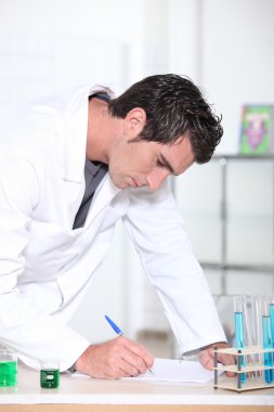 Scientist working in laboratory clipart