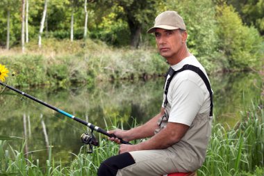 Man fishing in stream clipart