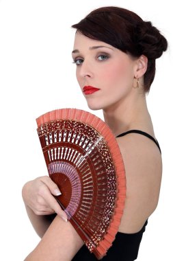 Spanish dancer holding a fan clipart