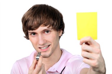 Referee showing the yellow card clipart