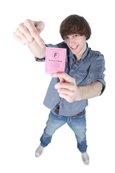 Young man pointing to driving license — Stock Photo, Image