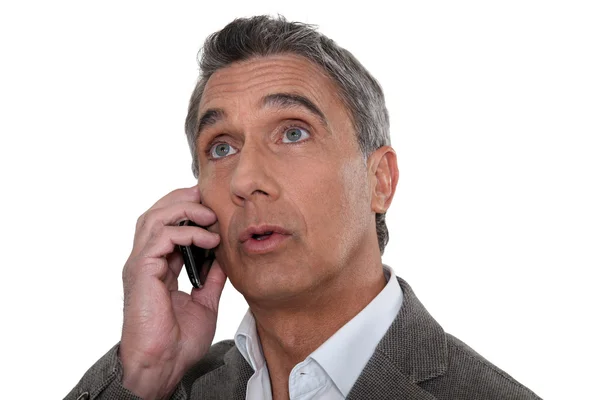 Surprised man looking at a screen — Stock Photo, Image