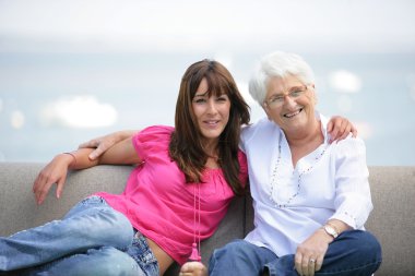 Young woman spending time with grandma clipart