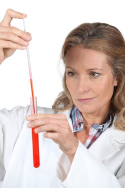 Female scientist with a test tube clipart