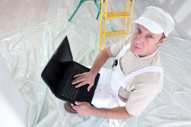 Decorator using laptop clipart