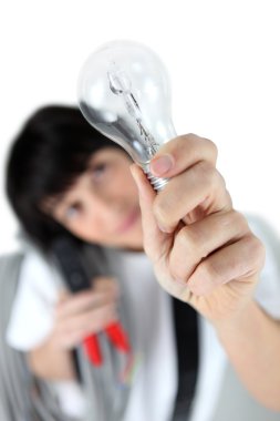 Craftswoman holding a bulb clipart