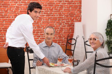 Elderly couple dining clipart