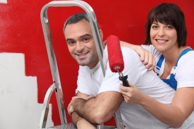 Couple repainting their apartment clipart