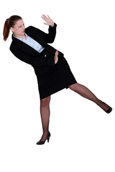 Businesswoman defending herself — Stock Photo, Image