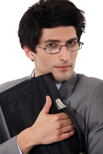 A man holding tight his briefcase. — Stock Photo, Image