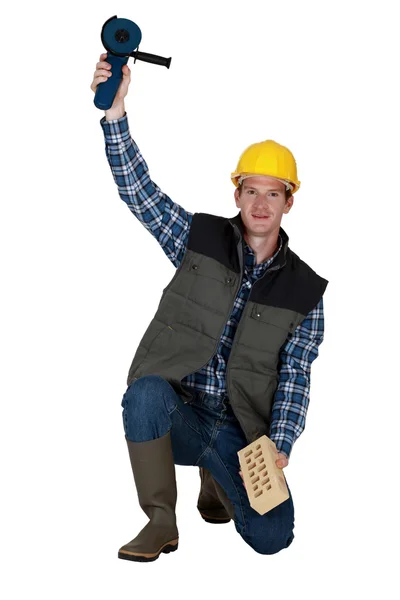 Man holding a circular saw — Stock Photo, Image