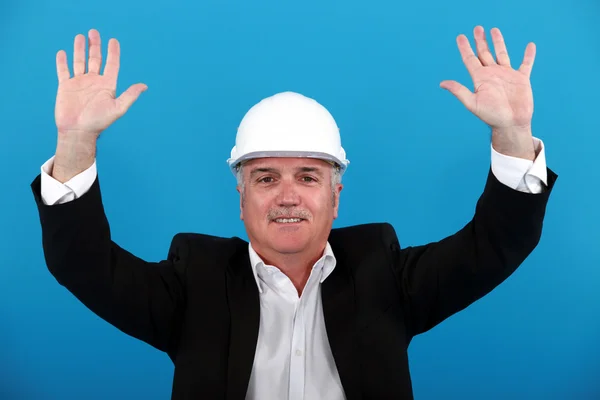 A mature architect rising his hands. — Stock Photo, Image