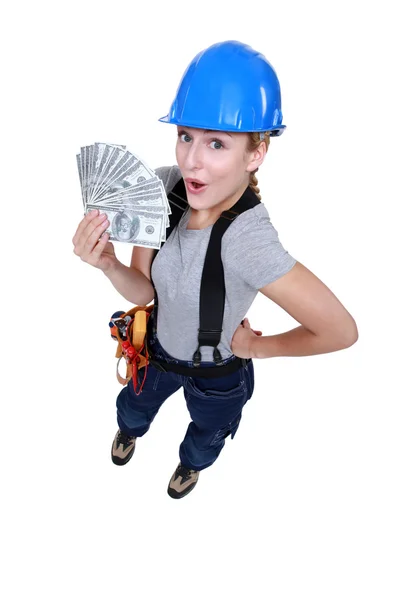 Craftswoman holding bills — Stock Photo, Image