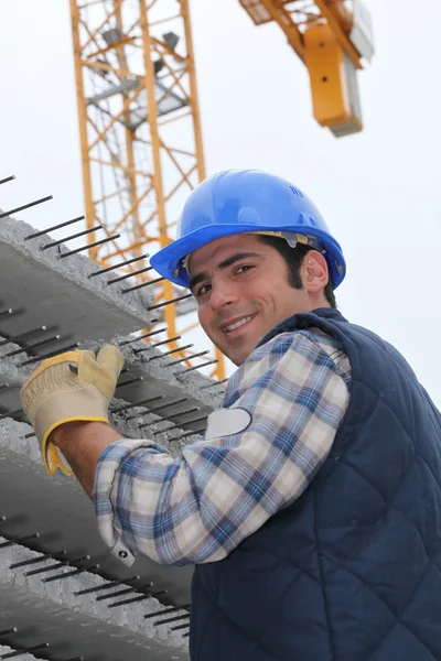 Construction worker with slabs of reinforced concrete — Stock Photo, Image