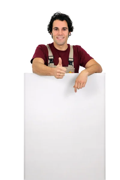 Worker pointing white plate — Stock Photo, Image
