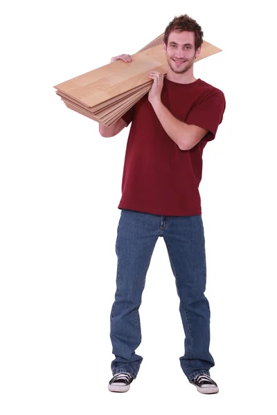 Young man about to lay parquet. — Stock Photo, Image