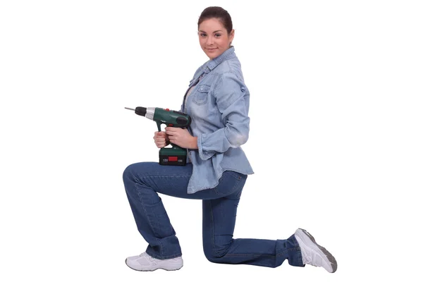 Craftswoman holding a drill — Stock Photo, Image