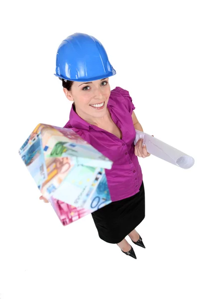 Female architect presenting house made for cash — Stock Photo, Image