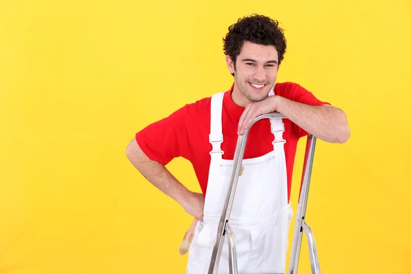 A painter standing on a ladder. — Stock Photo, Image