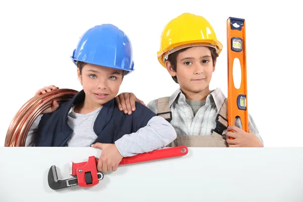 Niños disfrazados de constructores — Foto de Stock